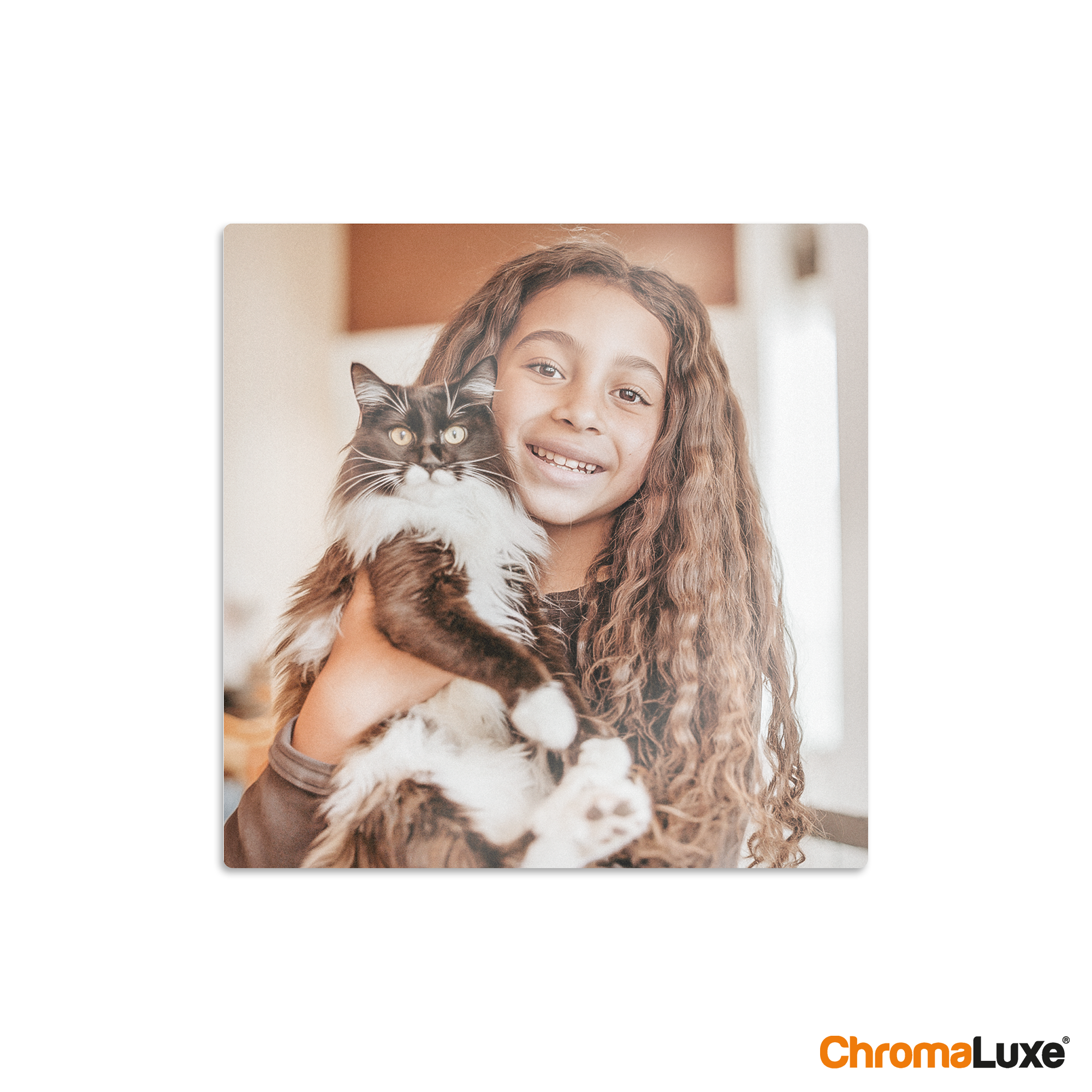 Chromaluxe aluminium photo print of a smiling girl holding a black and white cat, custom printed with your favorite memories.