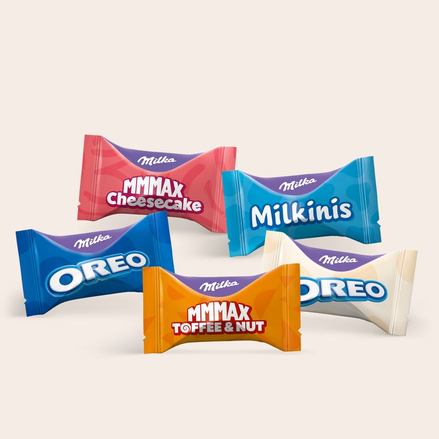 Milka Favourites Multipack-Geschenke – personalisiert Fünf verschiedene personalisierte Milka Schokoriegel-Variationen, jeweils in lila Verpackung, aufgereiht, Verschenke einen Hauch lila Freude, nur für sie gemacht.
