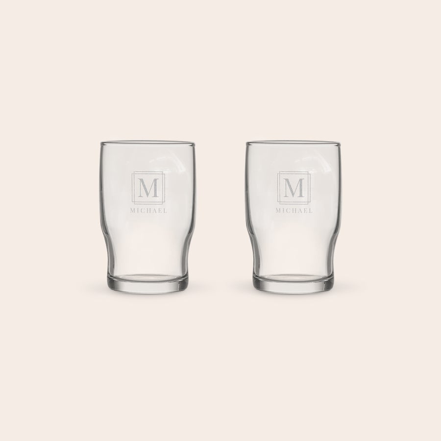 Personalised water glass Two personalised water glass with the initial M and name Michael engraved on each.