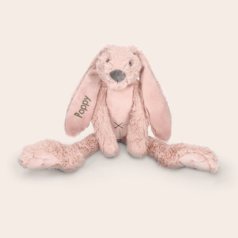 Personalised cuddly toy - Happy Horse - Rabbit Richie A soft pink Rabbit Richie plush toy with a personalized embroidered name Poppy on its left ear