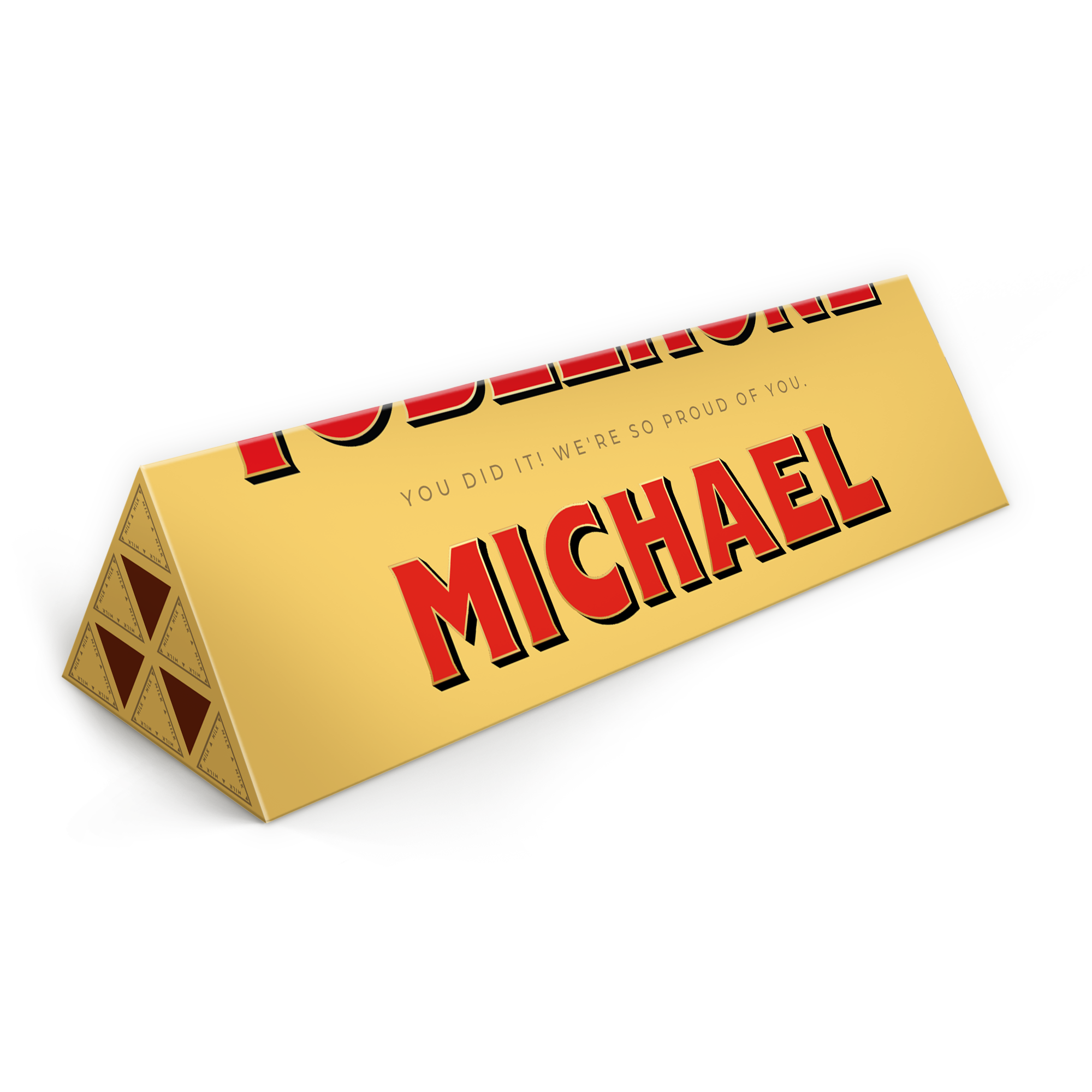 Baton Toblerone personalizat - 1800 grame, ambalaj auriu cu mesajul "You did it! We're so proud of you." și numele "MICHAEL" imprimat cu litere mari roșii.