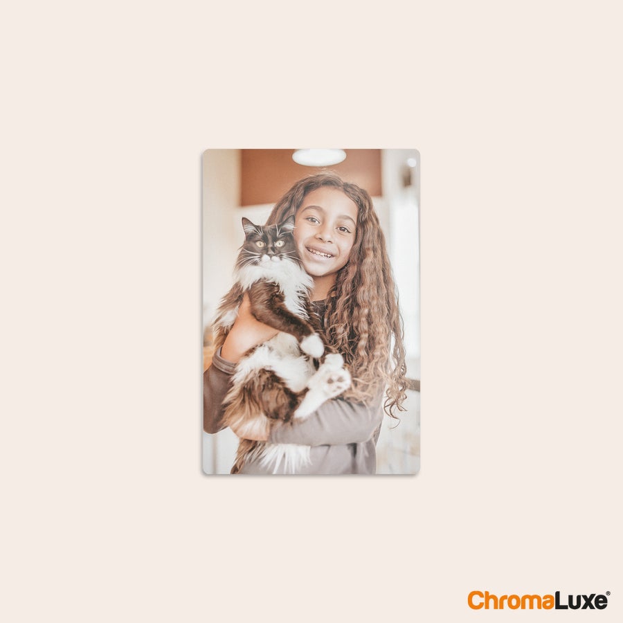 Aluminium photo panel Chromaluxe aluminium photo print of a girl smiling and holding a black and white cat, capturing favorite memories