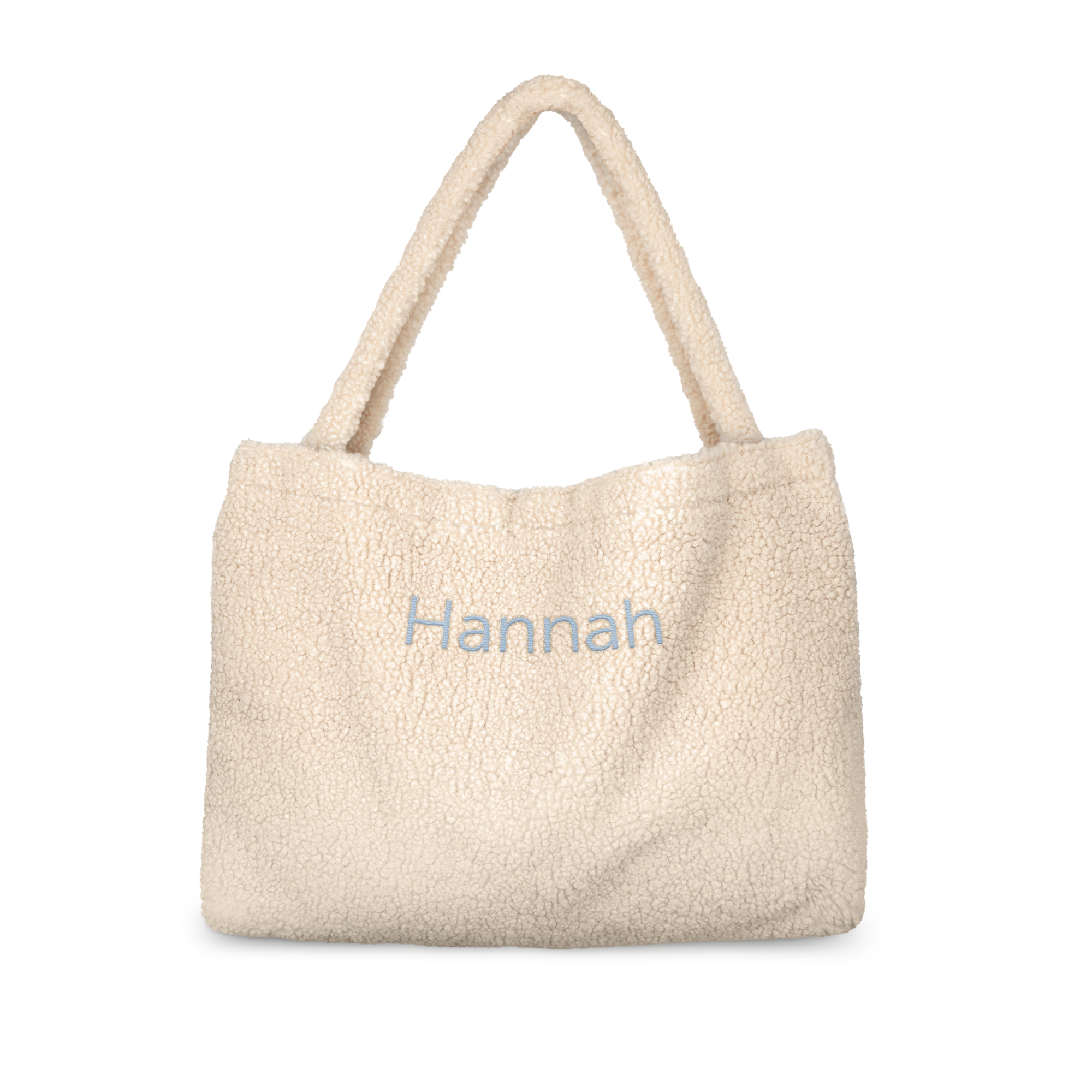 Bolsa de pelúcia bege personalizada com o nome Hannah bordado em azul, para surpreender seus entes queridos.