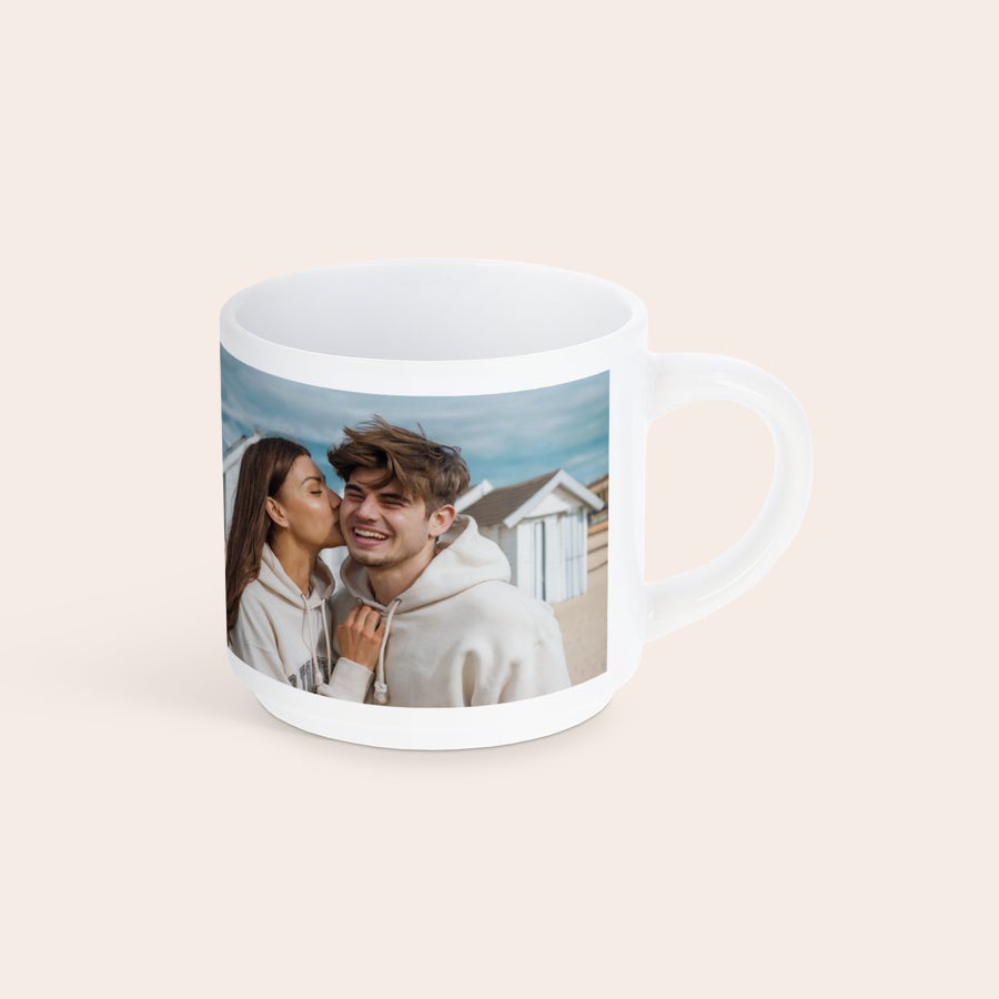 Stackable mugs with photo White stackable photo mug printed with a picture of a woman kissing a man on the cheek. Capture your moments.