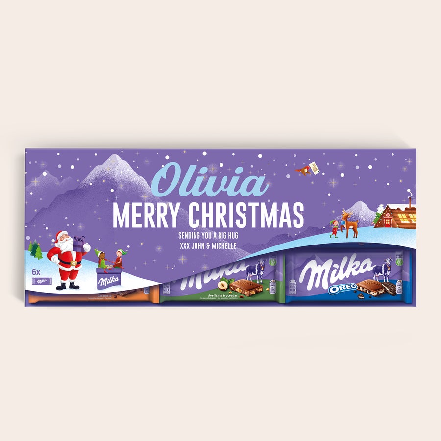 Personalizovaná Mega Milka Personalizovaná XXL čokoládová tyčinka Milka s menom Olivia a textom Merry Christmas, potlačená vianočným motívom.