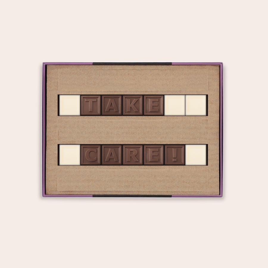 Chocotelegram® Pudełko z personalizowaną czekoladą mleczną z wiadomością ukrytą w czekoladzie napisem TAKE CARE oraz spacjami z białej czekolady