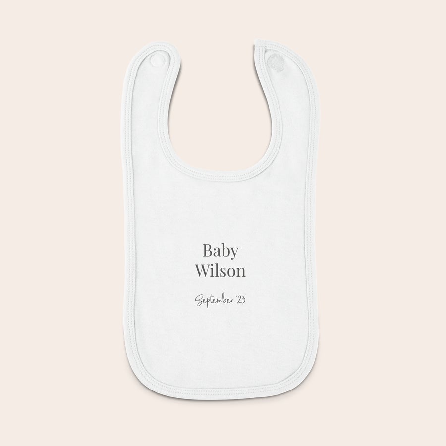 Bavaglino Bavaglino personalizzato bianco con scritta Baby Wilson e la data September 23 stampata