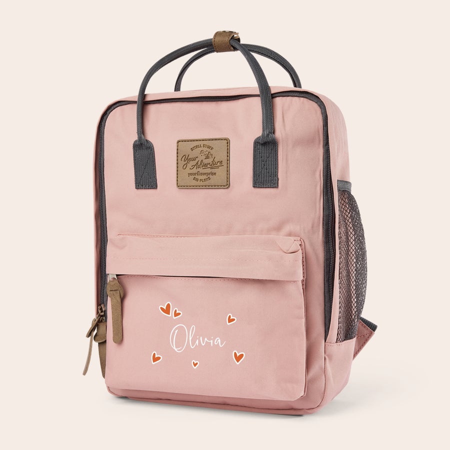 Mochila infantil personalizada Mochila infantil rosa personalizada con el nombre "Olivia" impreso y corazones naranjas, ideal para la vuelta al cole.