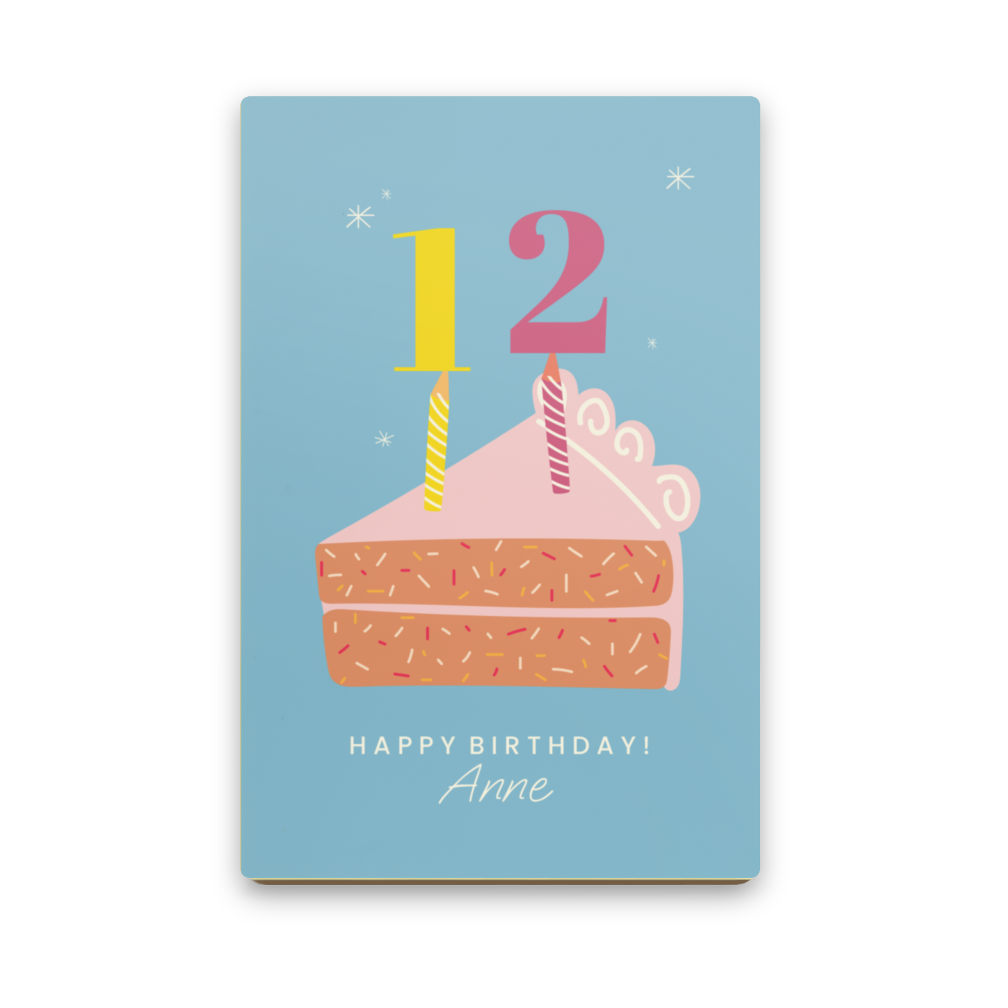 Personalised chocolate letter with a cartoon cake, candles for the number 12, Happy Birthday, and Anne printed on it