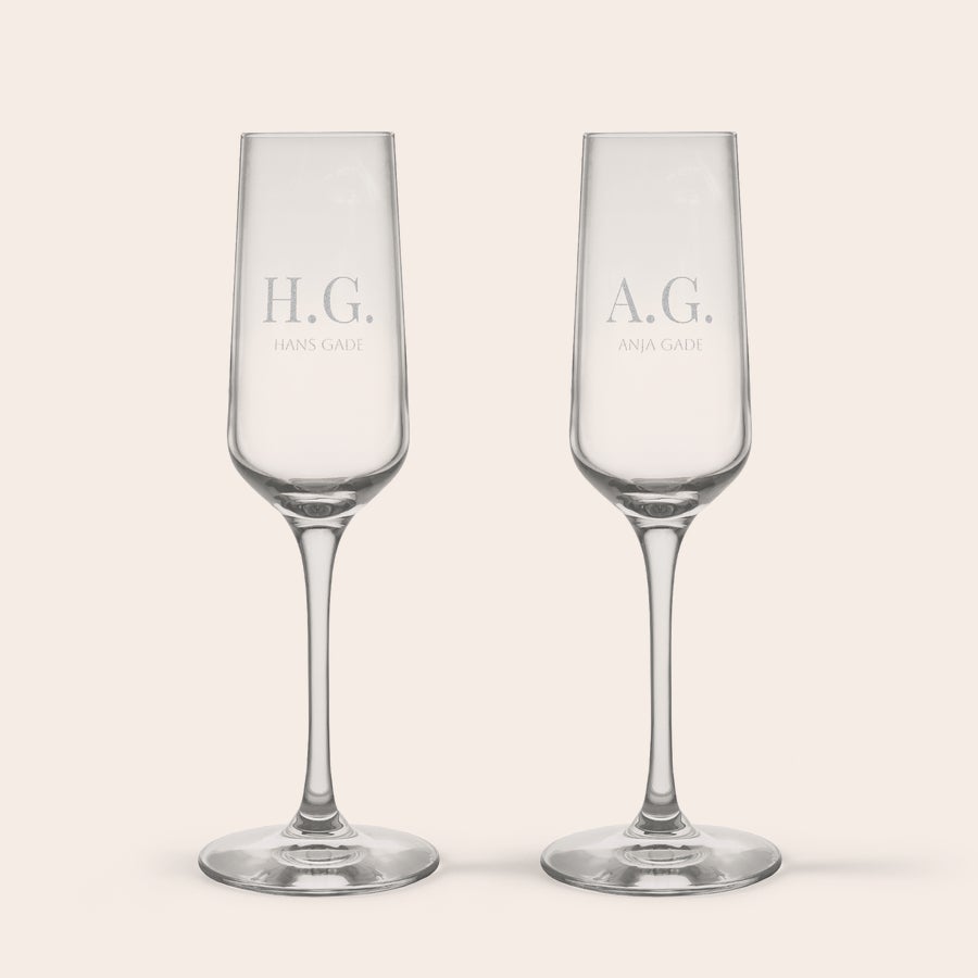 Champagneglas To Stölzle Lausitz krystal champagneglas med H.G. HANS GADE og A.G. ANJA GADE navn indgraveret.