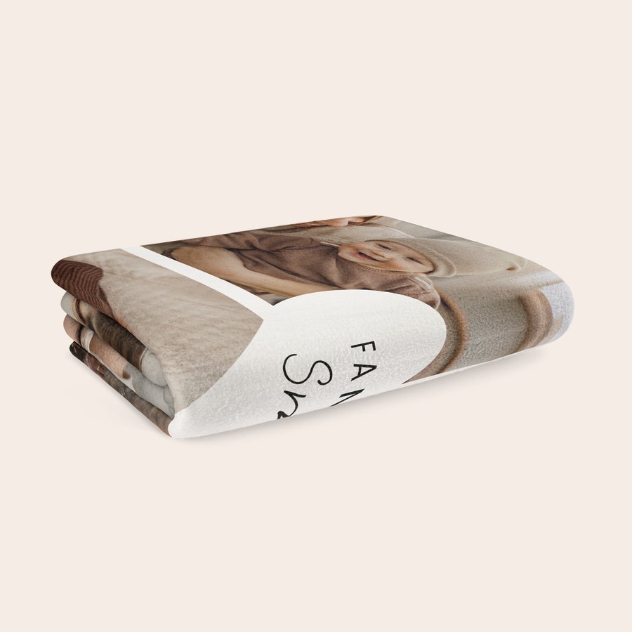 Personalised photo blanket Folded fleece photo blanket with an image of a baby and Family Shine printed on a white heart