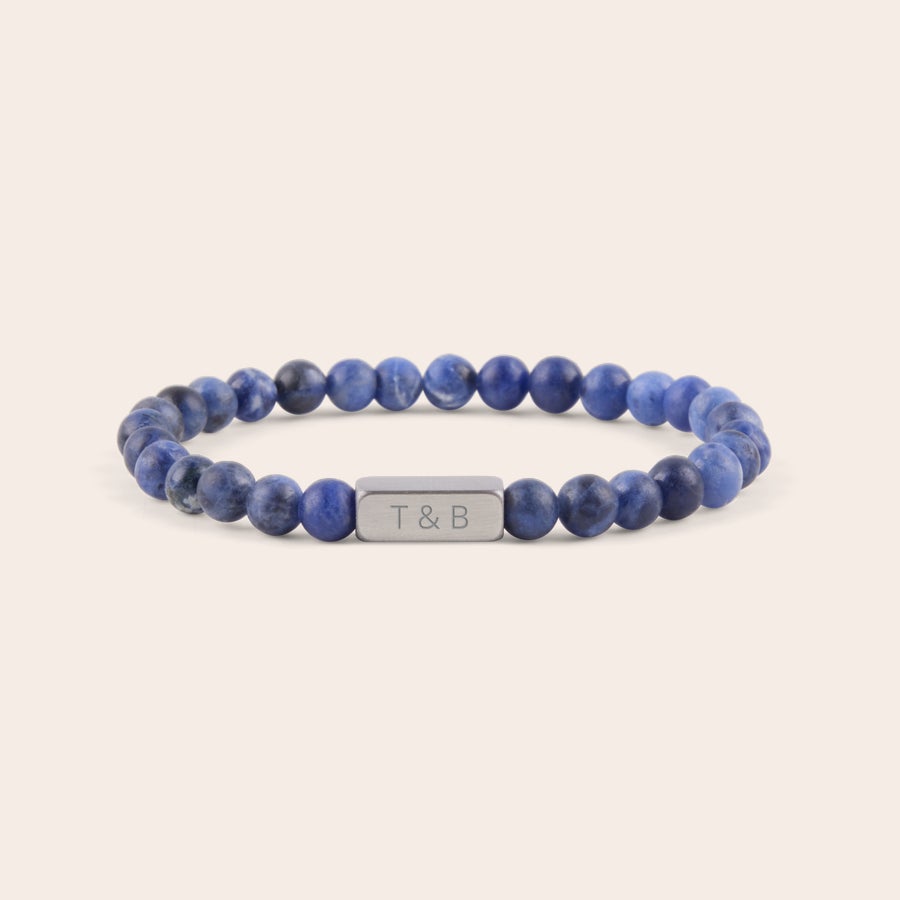 Personalised gem stone bracelet Personalized Steel & Barnett bracelet with blue gemstone beads, engraved with T & B on a metal tag.