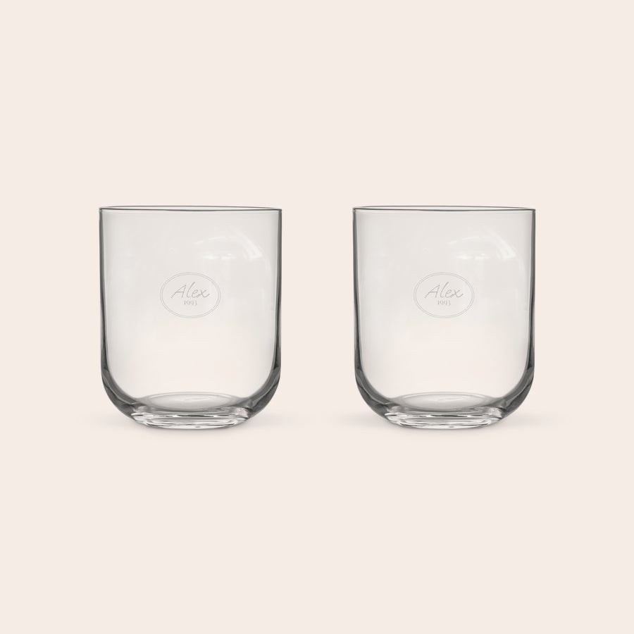 Personalised water glass Two personalised water glasses with Alex 1993 engraved in an oval design