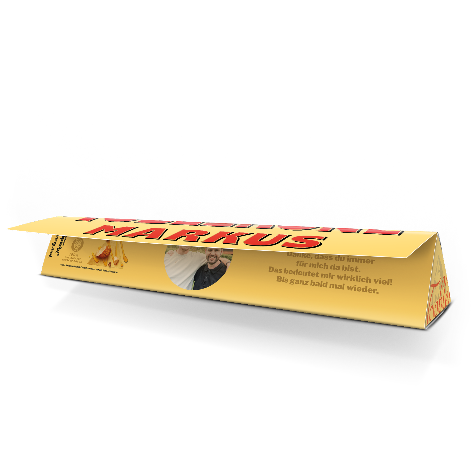 Personalisierte Toblerone Schokolade mit dem Namen Markus, gedrucktem Foto von zwei Männern und einer Dankesnachricht.