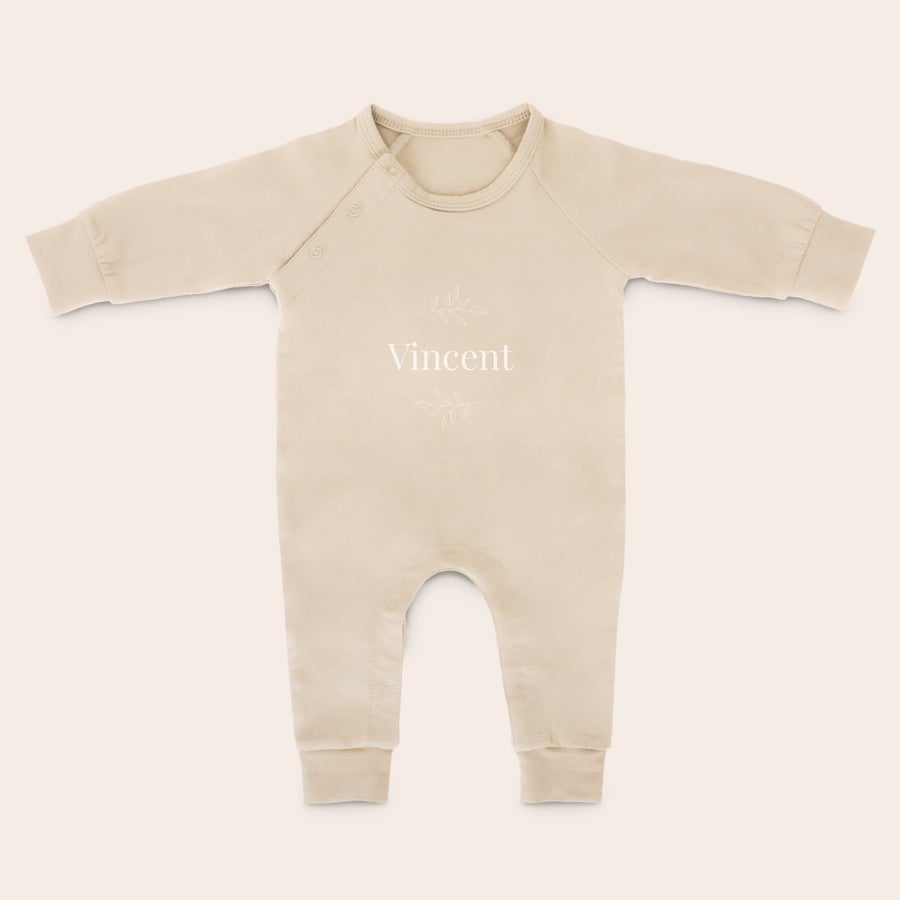Baby Playsuit - Printed A beige personalized babygrow with the name Vincent and leaf accents printed on the chest for stretching and kicking those chubby legs.