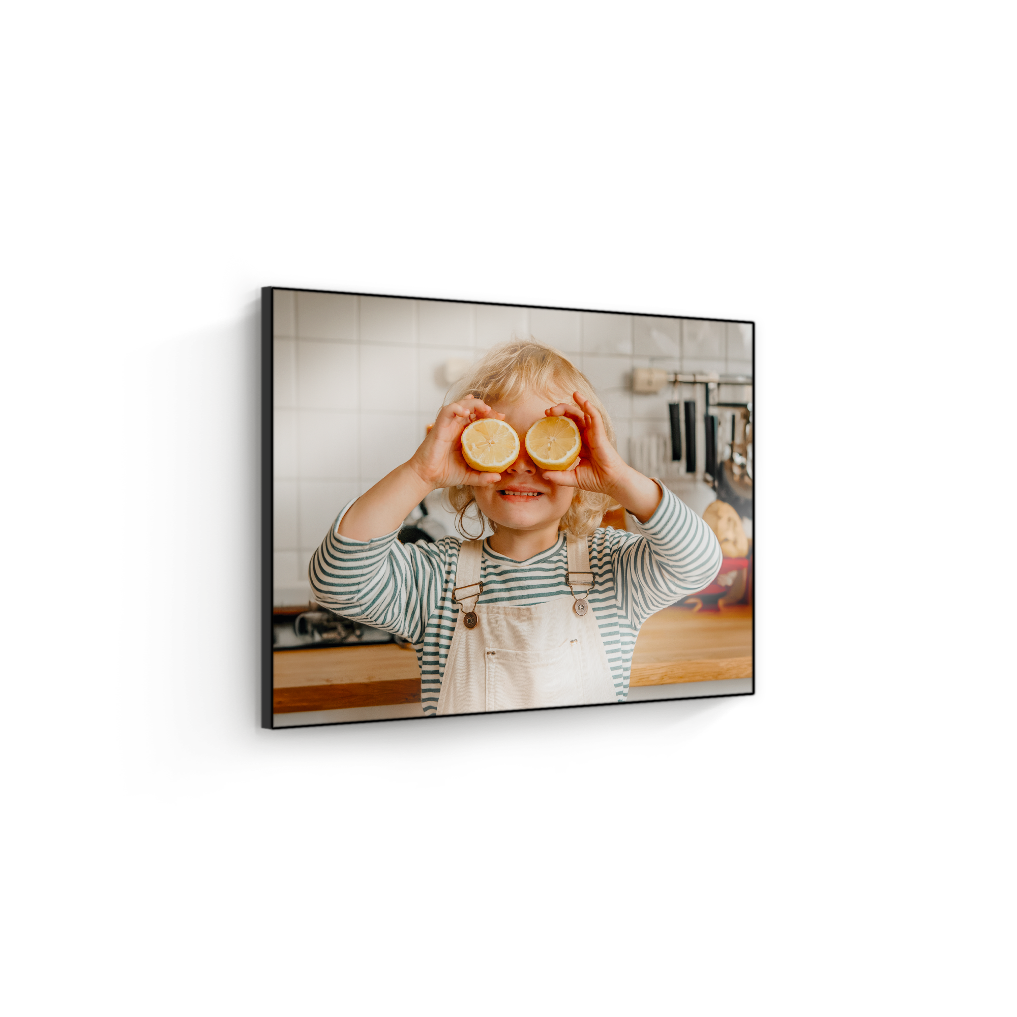 ChromaLuxe wooden photo panel printed with a photo of a child holding lemons over their eyes