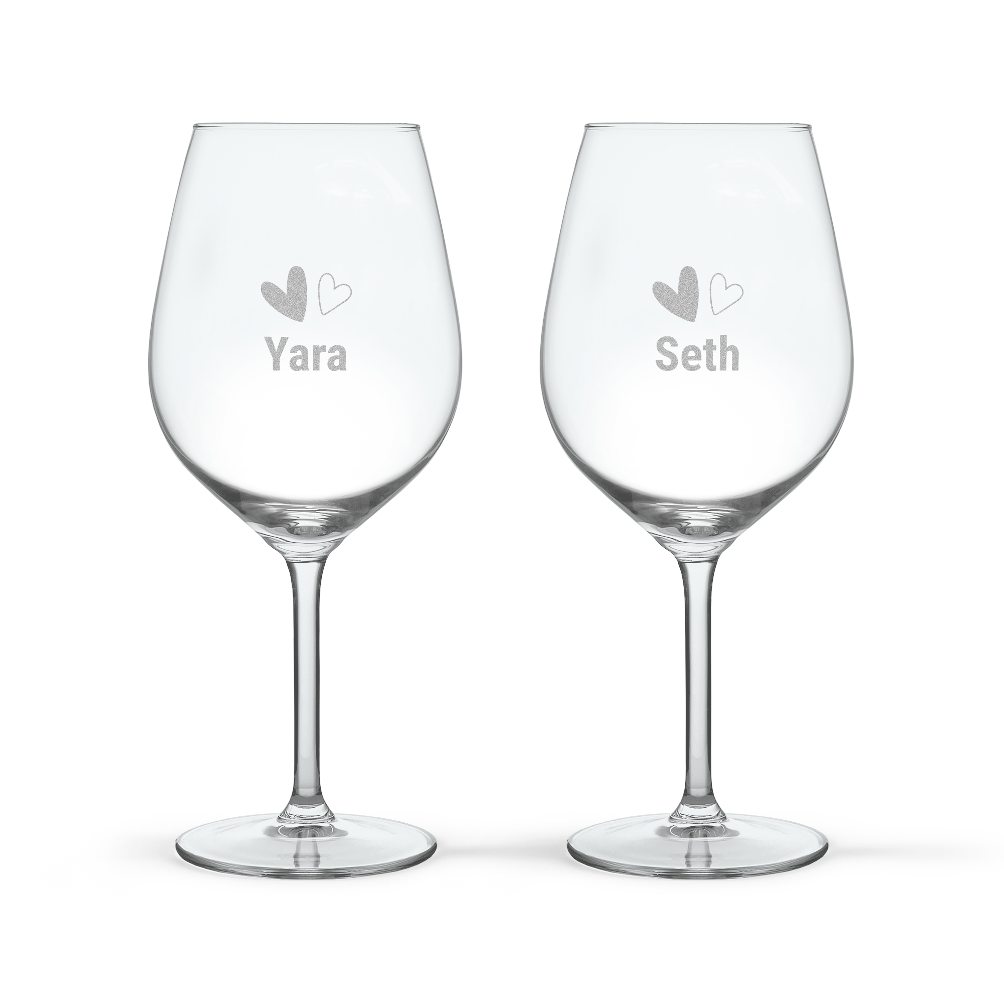 Two personalised Aperol Spritz glasses, each engraved with a name Yara and Seth and two hearts