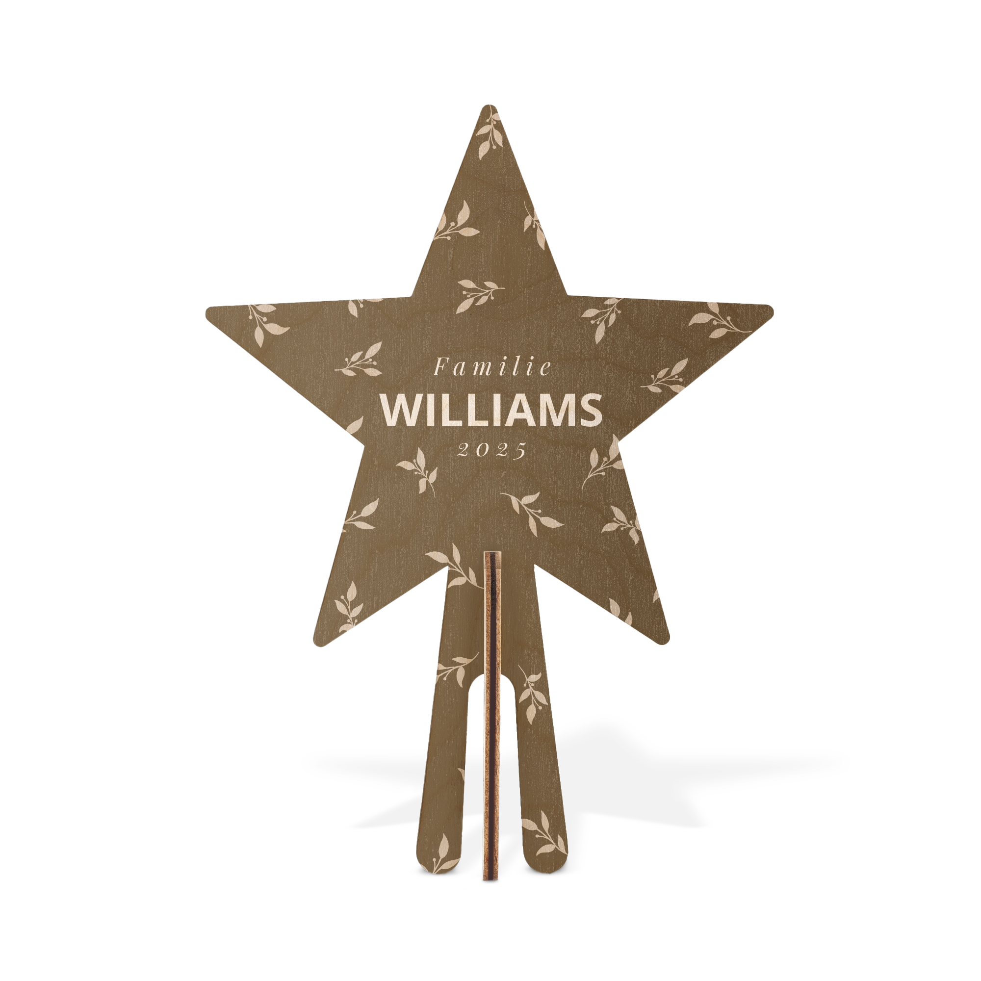 Stjerneformet skreddersydd tretopp i tre, trykket med bladmønster og navn "Familie Williams 2025" for en personlig jul.