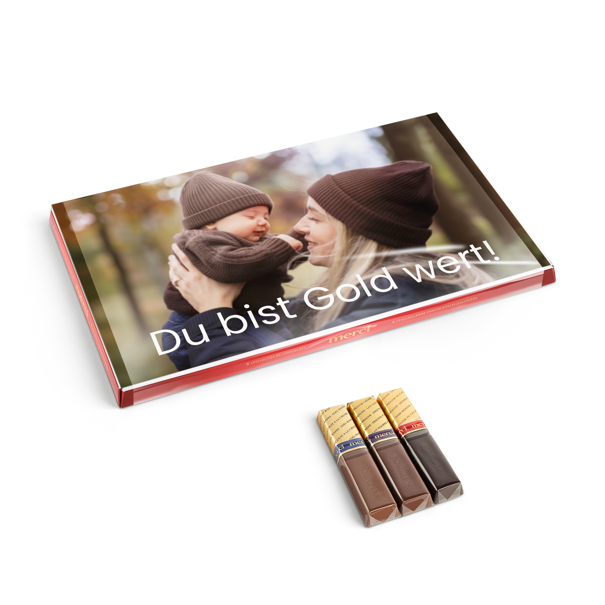 Merci Schokolade mit personalisierter Grußkarte 400 Gramm. Eine bedruckte Schachtel mit einem Foto von Mutter und Baby und dem Text Du bist Gold wert.