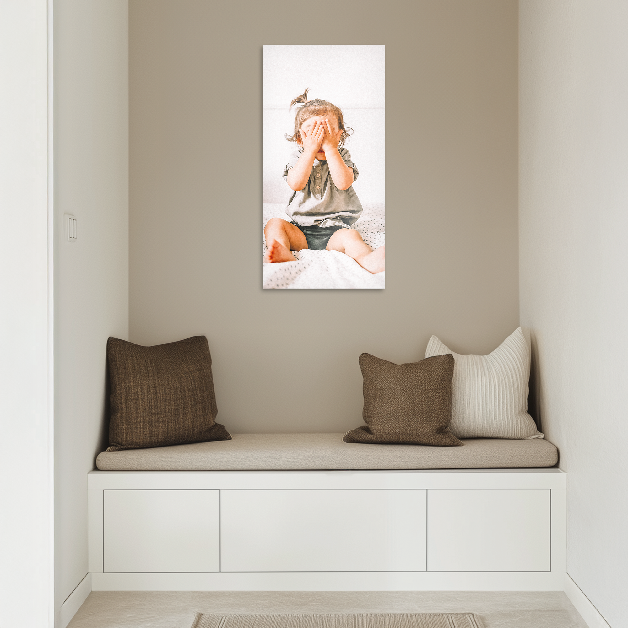 Chromaluxe aluminium photo print of a baby playing peekaboo, a unique way to capture your favorite memories.