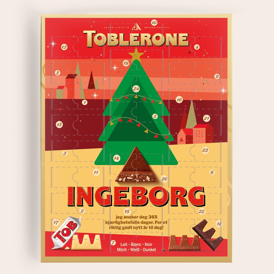 Adventskalender med bilde - Toblerone 2025 Rød Toblerone adventskalender med en grønn juletre-illustrasjon, tilpasset med navnet Ingeborg.
