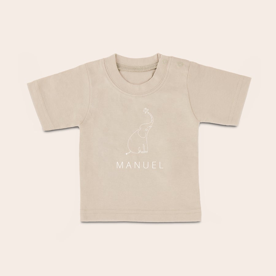 Baby shirt bedrukken Beige baby shirt met naam Manuel en een olifantje, bedrukt met eigen ontwerp.