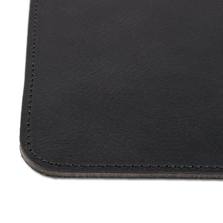 Personalised leather coasters Close up of a black leather coaster with stitched edges, ready to be engraved with your design or text