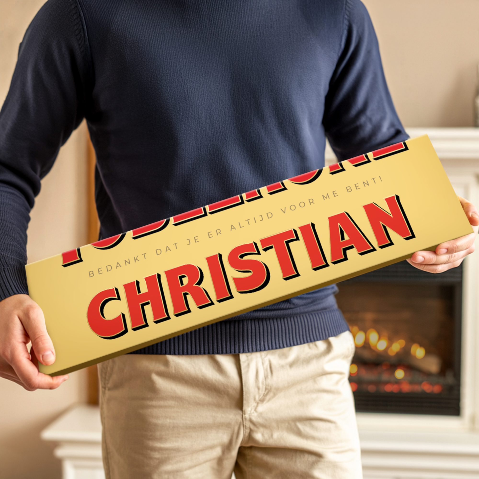 Een Toblerone reep met naam - 3600 gram, gepersonaliseerd met de naam CHRISTIAN en een bedanktekst in rood op gele verpakking.