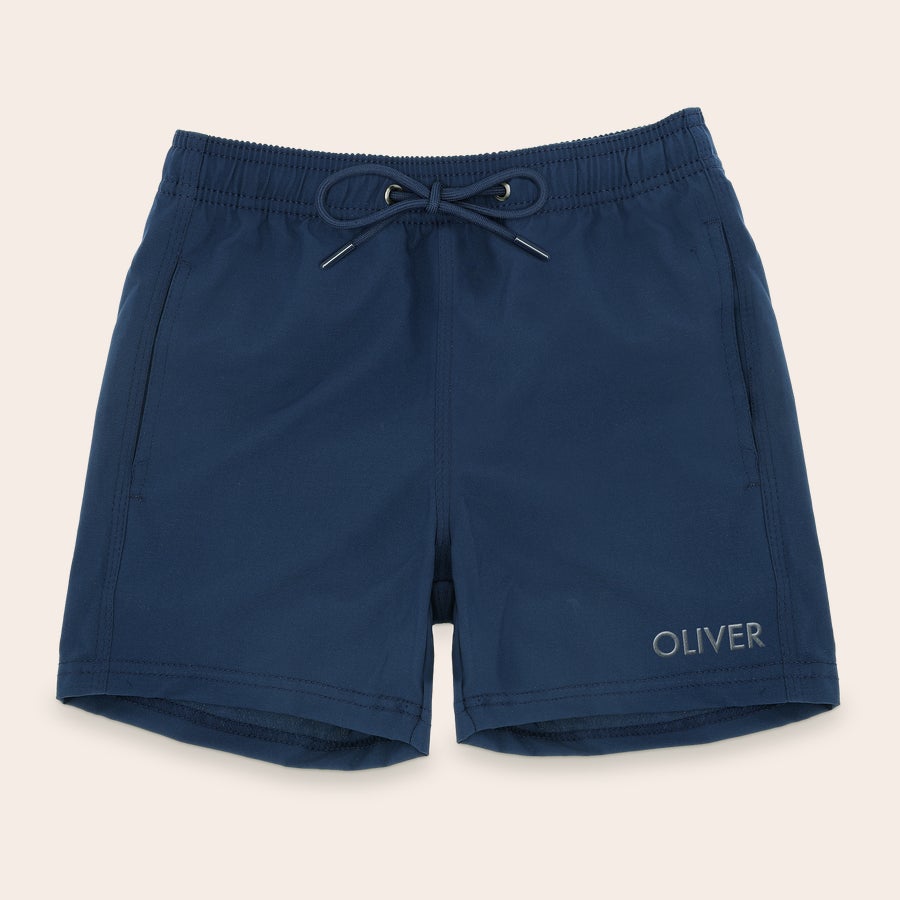 Bañadores personalizados Shorts de baño azules para hombre, con el nombre Oliver bordado en blanco, y cordones ajustables en la cintura.