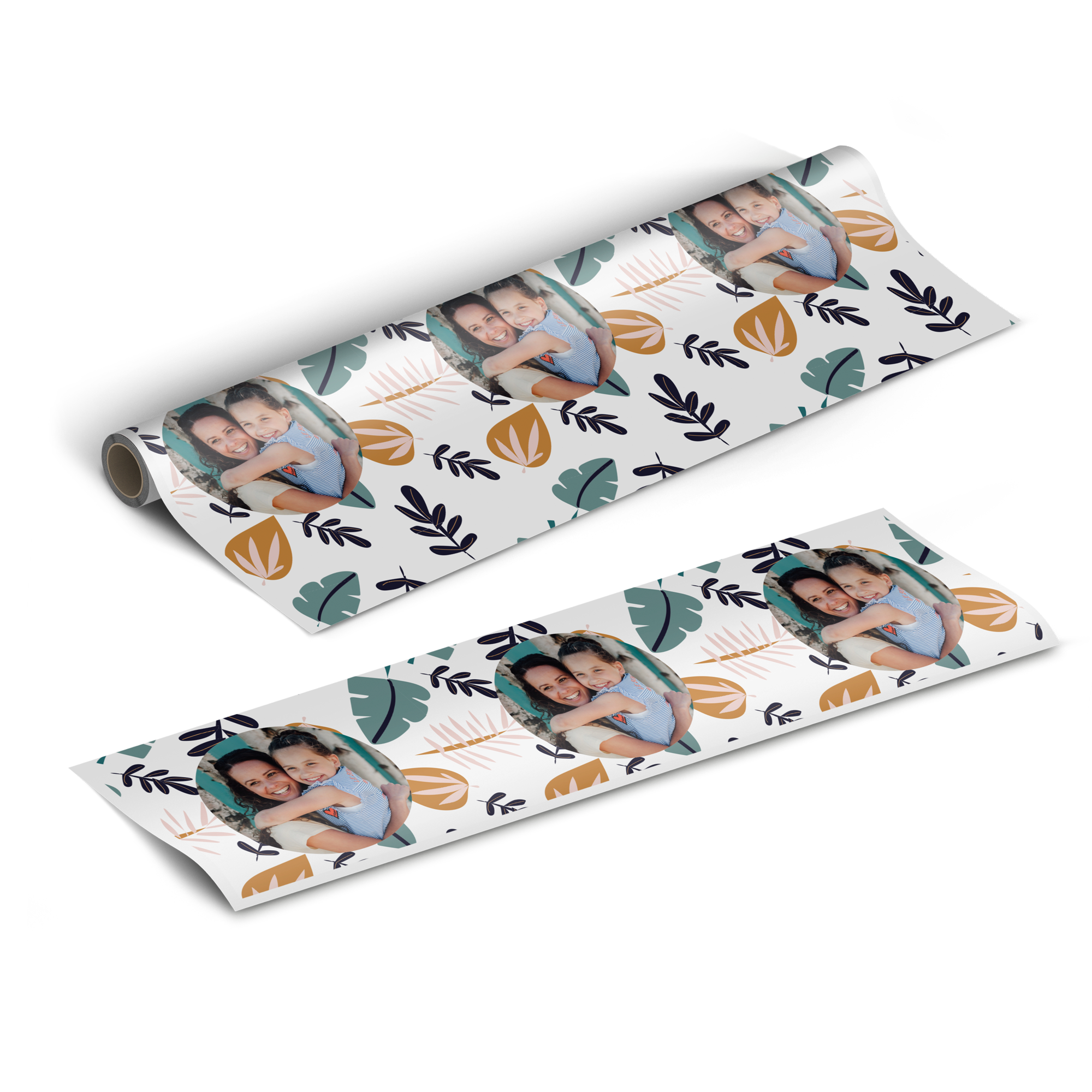 White personalised wrapping paper with a pattern of abstract leaves and printed photos of a smiling woman and girl.