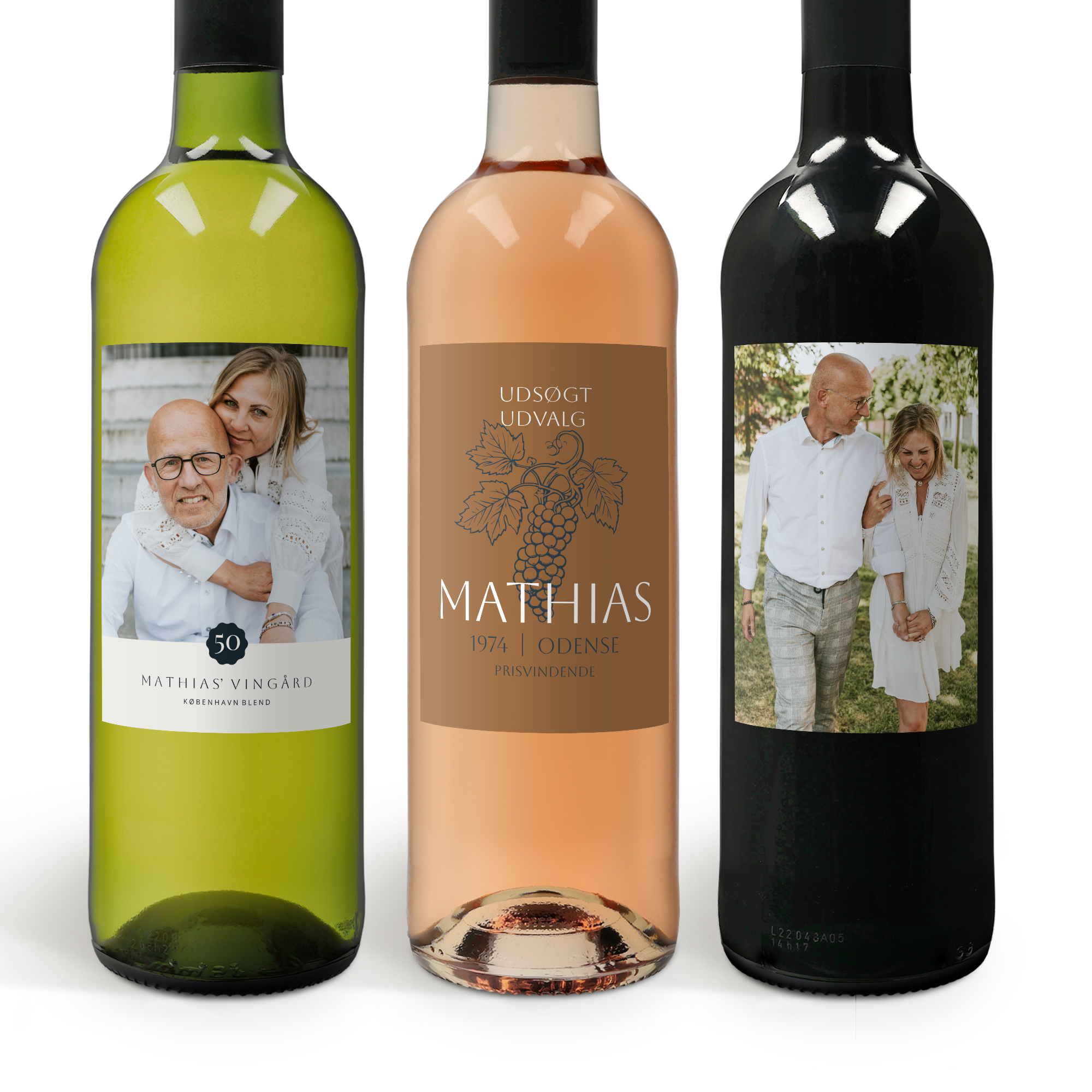 Tre flasker Belvy vin med personlige labels; hvidvin, rosé og rødvin, med fotos og navnet Mathias.