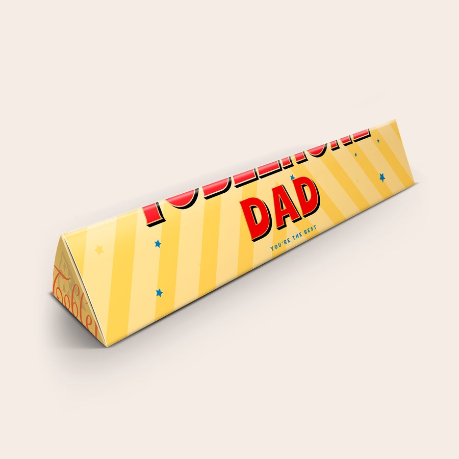 Barra Toblerone - Día del Padre Barra de chocolate personalizada Toblerone con envoltorio amarillo, rayas y estrellas, impresa con "DADDY YOU'RE THE BEST".