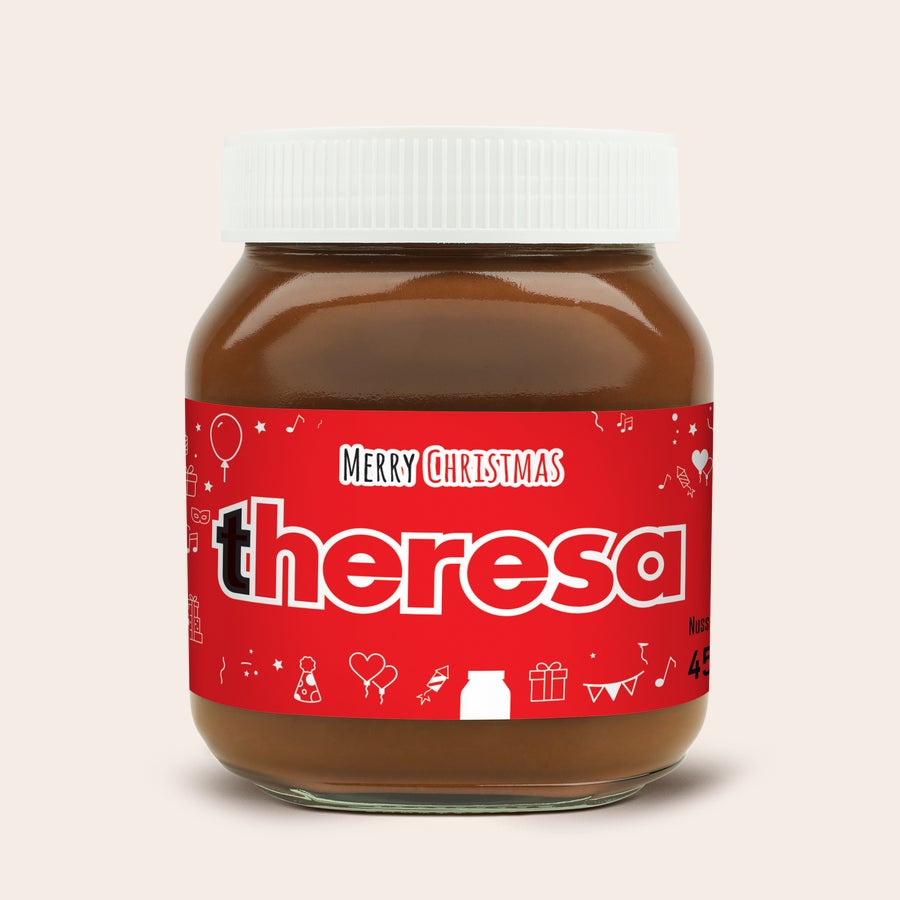 Personalisiertes nutella®-Glas Personalisiertes nutella® Glas mit dem Namen Theresa und Frohe Weihnachten auf rotem Etikett, um deine Liebsten zu überraschen.
