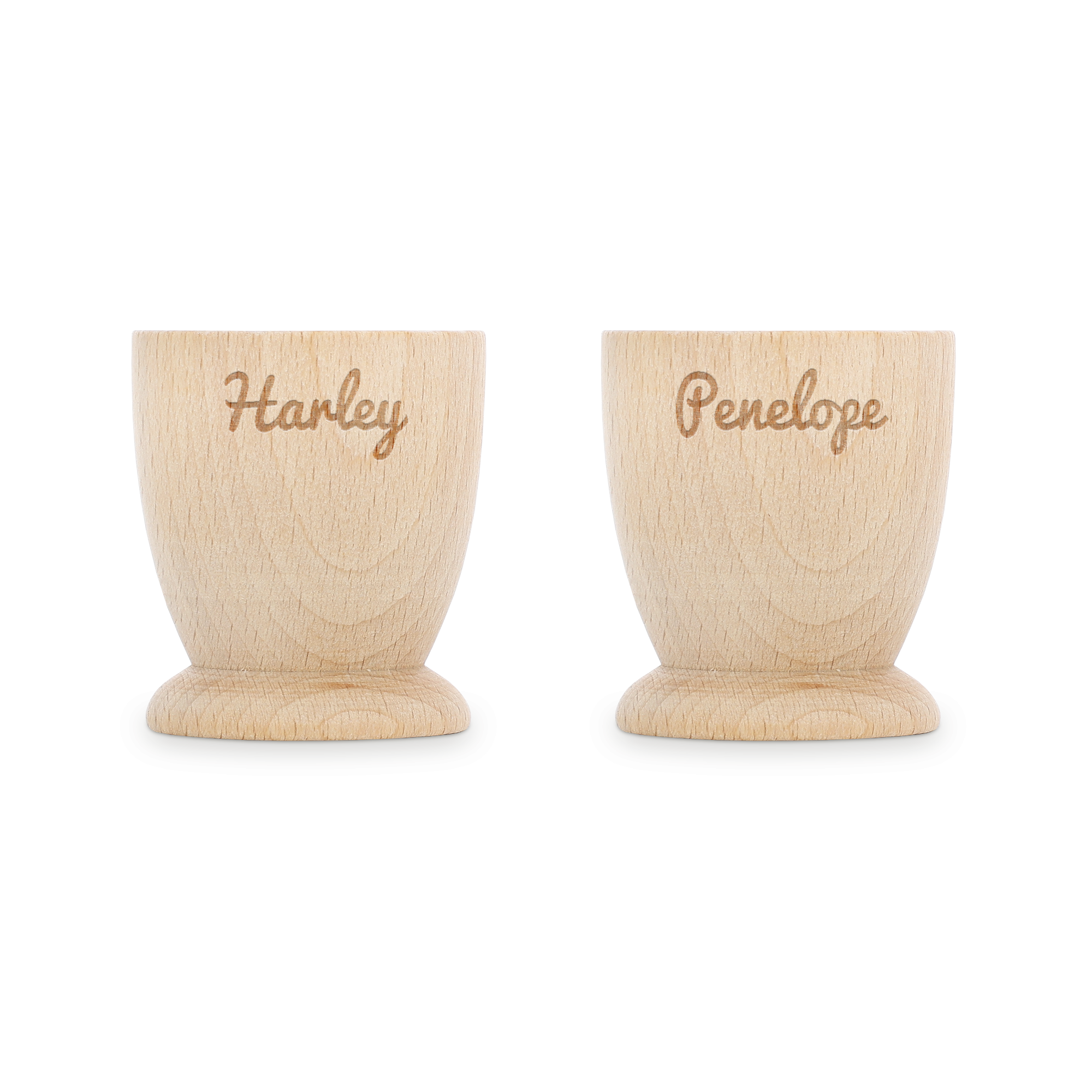 Dois copos de ovos personalizados de madeira de faia gravados com os nomes Harley e Penelope. Torne o café da manhã memorável.