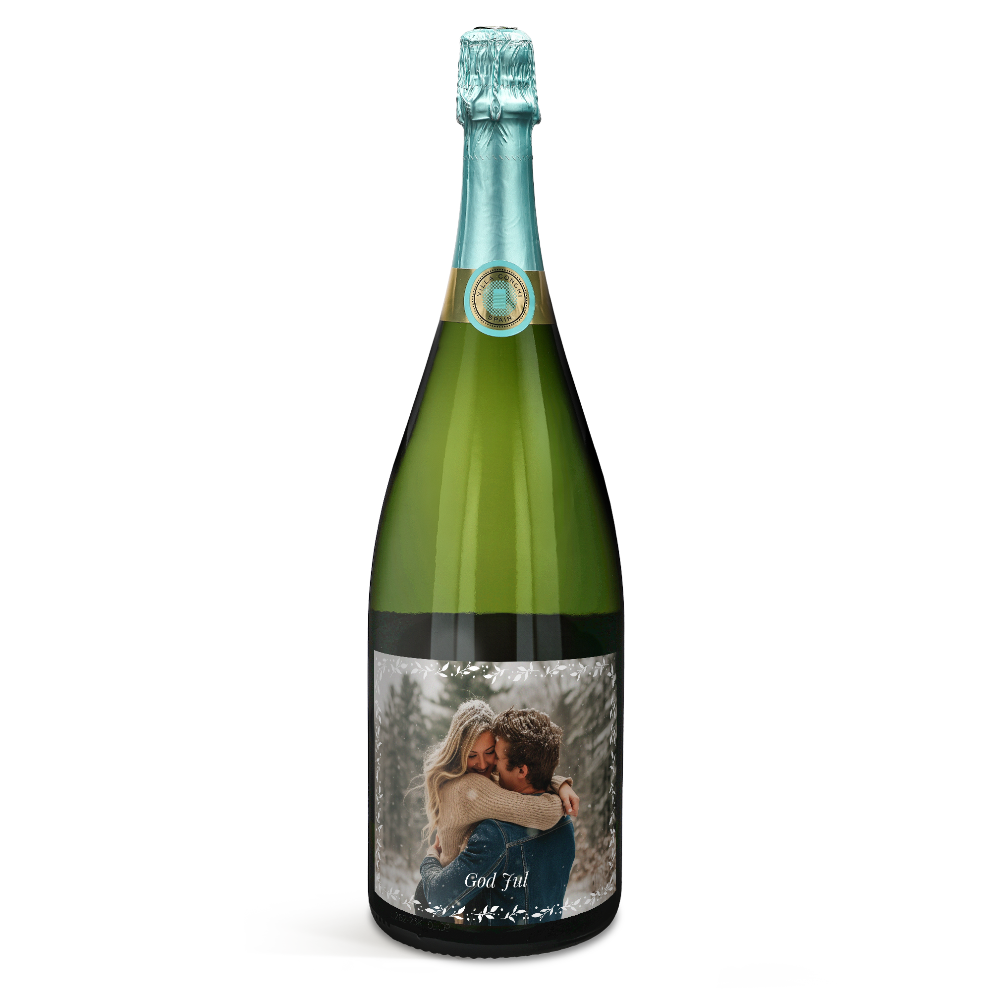 Grön Villa Conchi cava med egen etikett tryckt med bild på ett par och texten God Jul