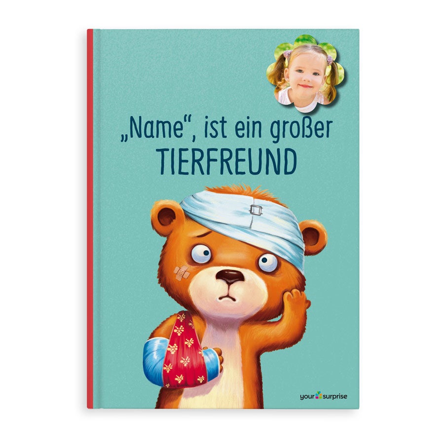 Personalisiertes Kinderbuch Das Kind hilft den Tieren, bedruckt mit Foto des Kindes und dessen Namen.