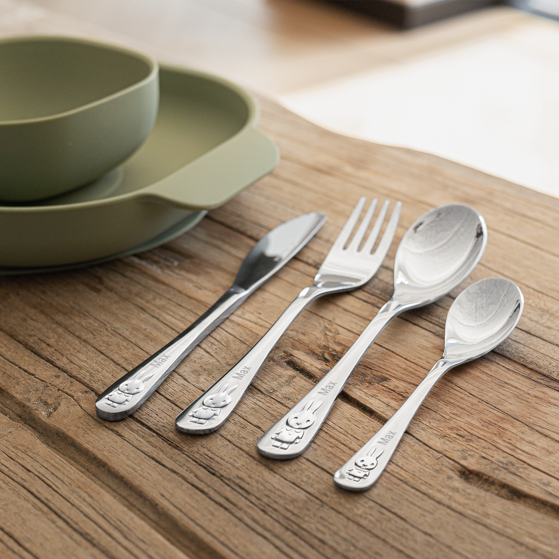 A personalized Miffy children's cutlery set with the name Max engraved on each utensil, featuring a Miffy design.