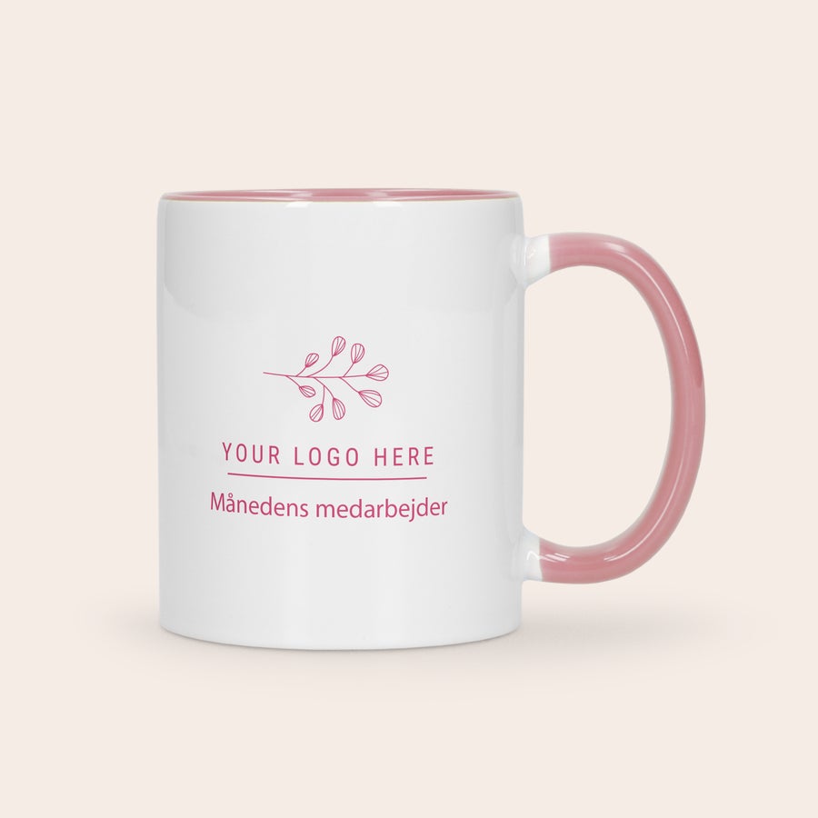 Farverig krus Hvidt krus med lyserødt håndtag og inderside, med print af logo og "Månedens medarbejder" som en flot farverig gave.