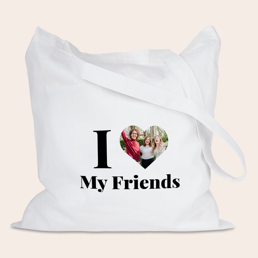 Vászontáska Fehér vászontáska egyedi fotónyomtatással, szív alakú képpel három boldog barátról és fekete "I My Friends" felirattal