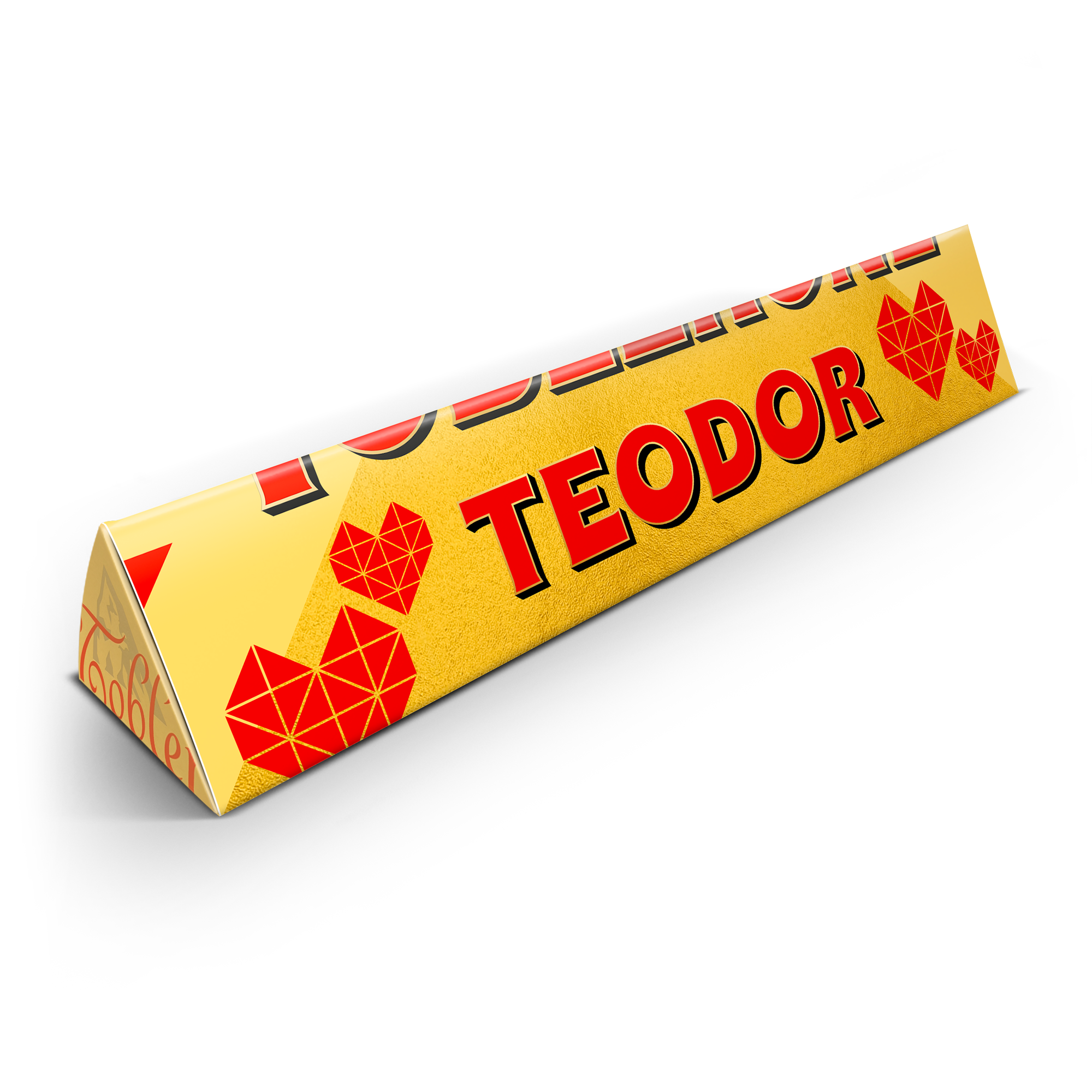 Gul Toblerone med personligt omslag, tryckt med namnet Teodor i rött och röda hjärtan.