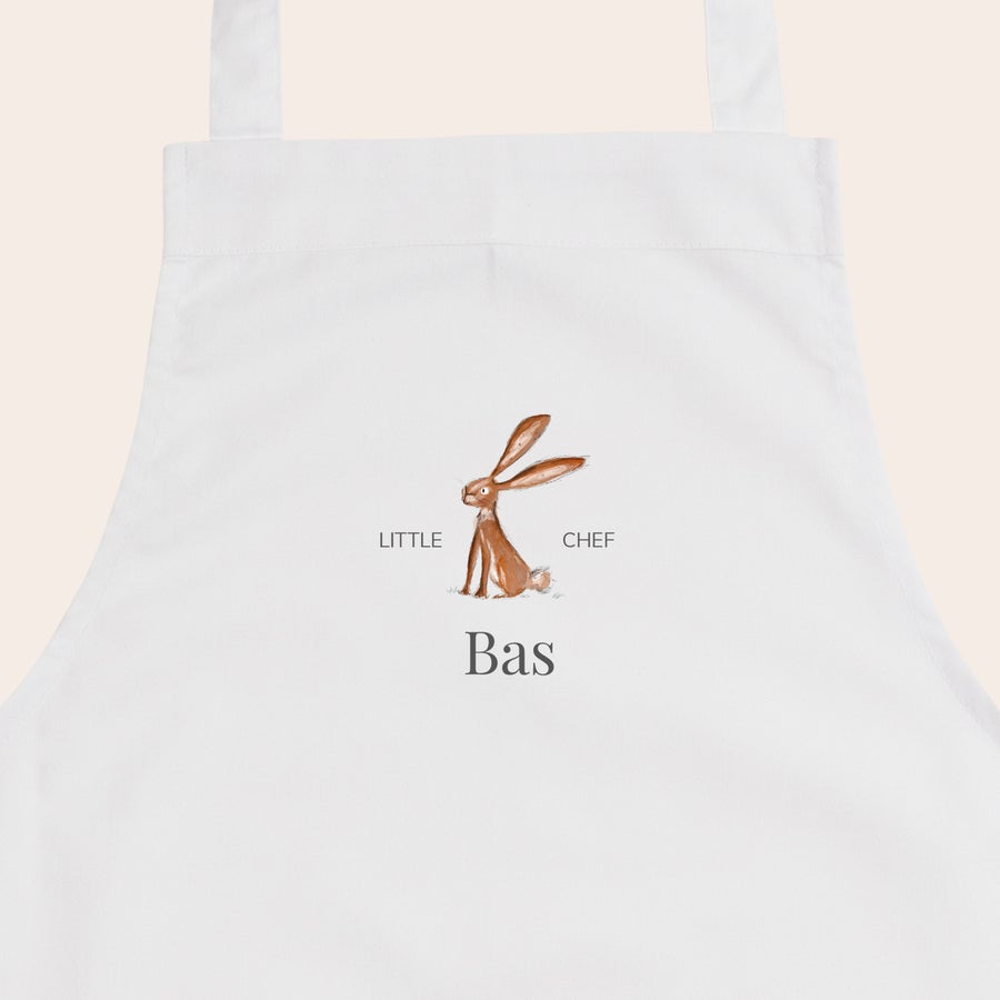 Șorț pentru copii Șorț alb pentru copii personalizat cu iepure, text "Little Chef" și numele "Bas" imprimat.