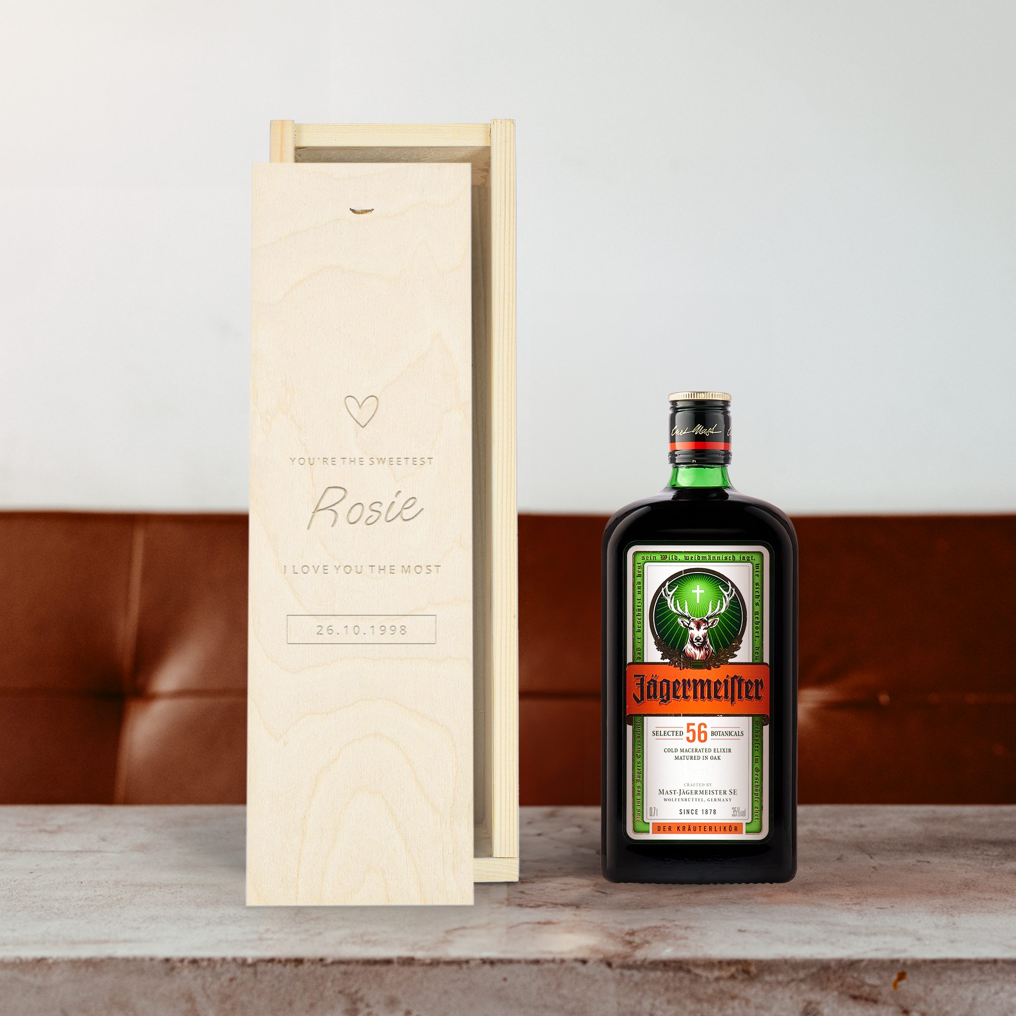 Jägermeister liqueur in an engraved wooden case personalized with Rosie, a heart, and a date