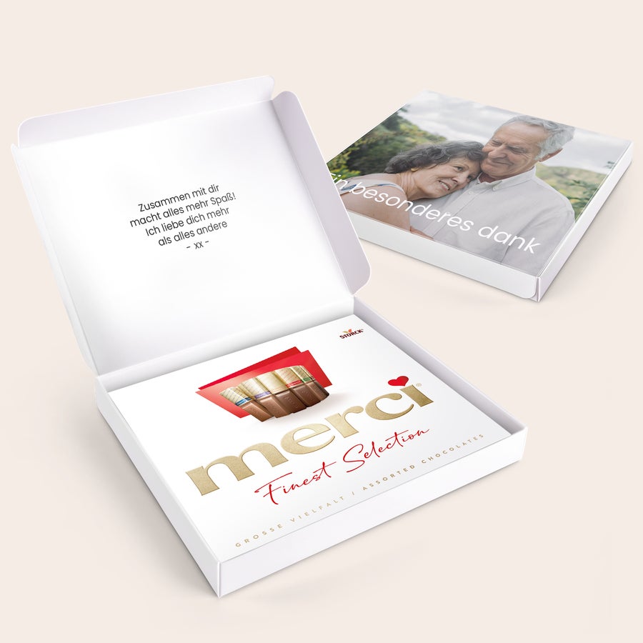 Merci Schokolade Personalisieren- 250 Gramm Merci Schokolade Personalisieren 250 Gramm mit eigener Botschaft und Foto auf der Geschenkverpackung bedruckt.