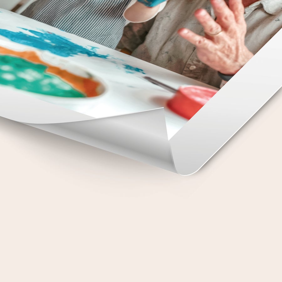Poster photo prints Personalized poster photo prints featuring a close-up of a person's hand painting a colorful design.