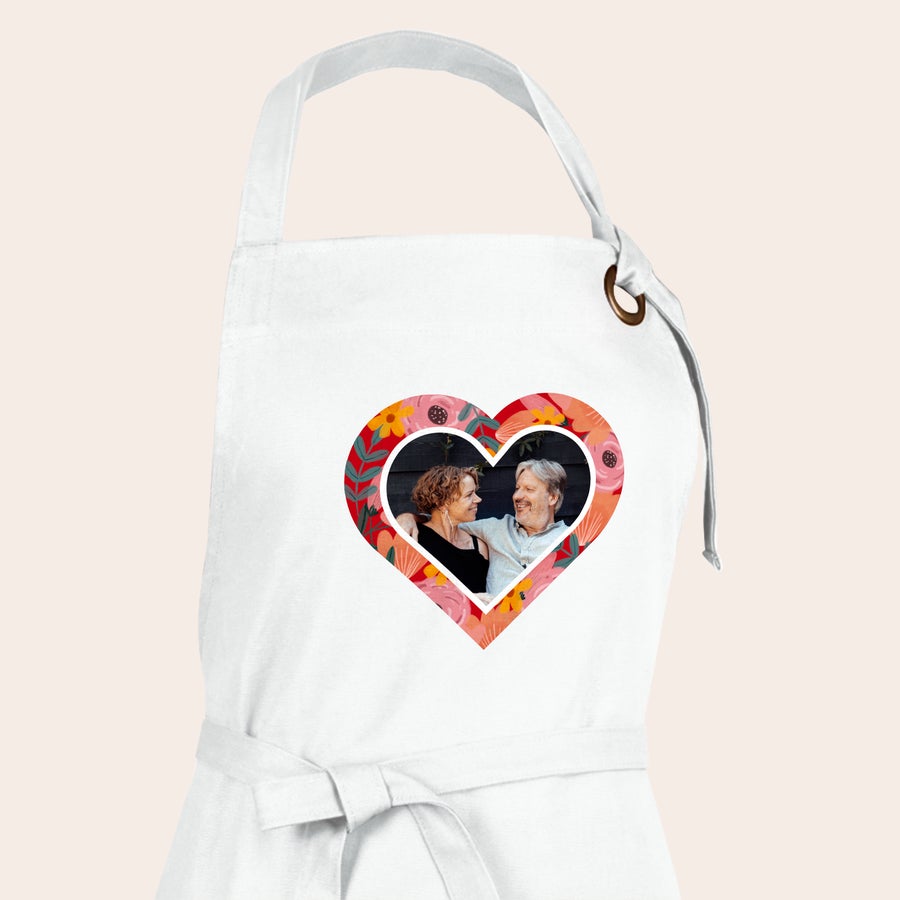 Apron White kitchen apron printed with a personalized photo of a couple inside a heart-shaped floral frame