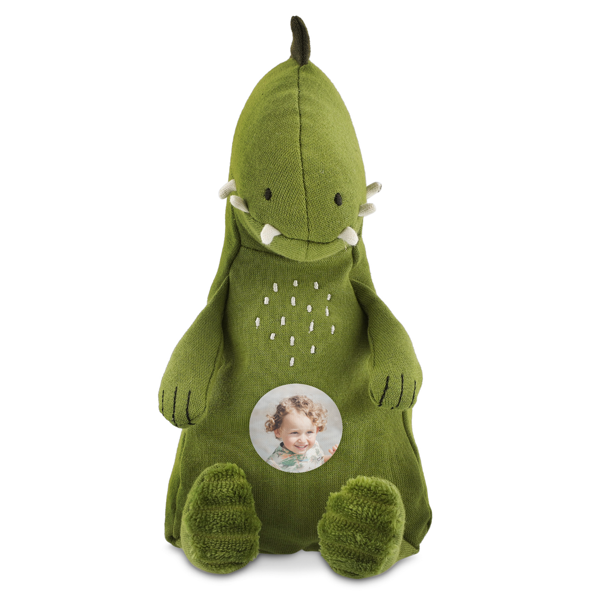 Grønt Trixie dinosaurkosedyr med et rundt, trykt bilde av et barn på magen, en personlig overraskelse.