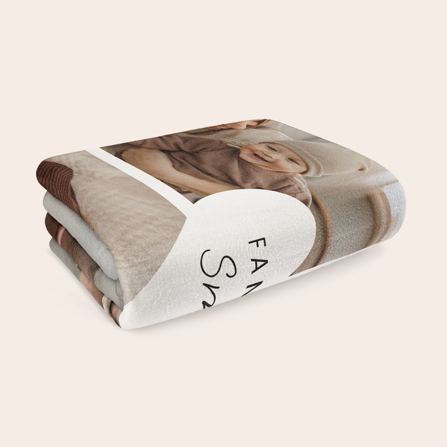 Personalised photo blanket Folded personalised fleece blanket printed with a photo of a baby and Family text