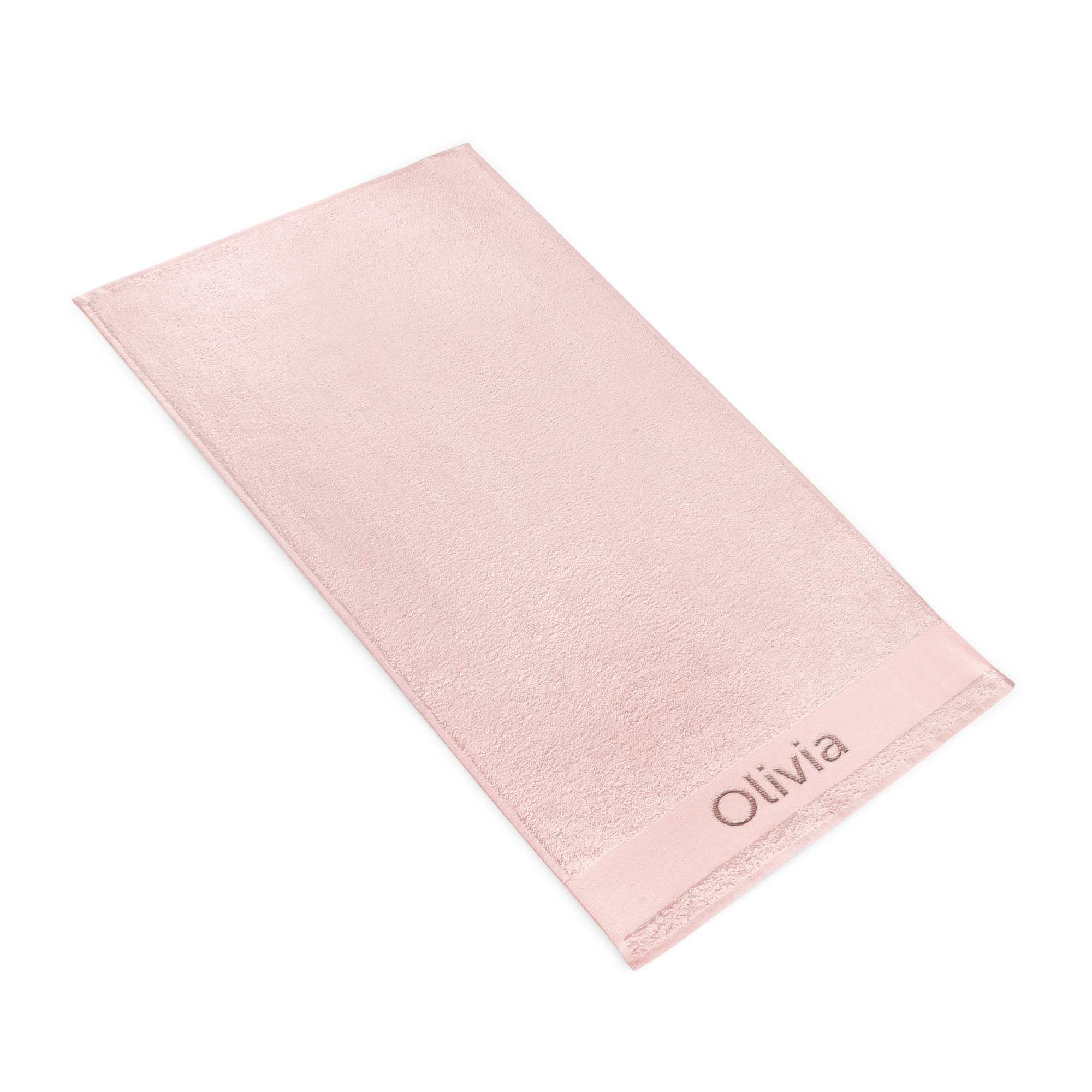 Toalla rosa personalizada con el nombre "Olivia" bordado en un extremo, hecha de algodón suave.