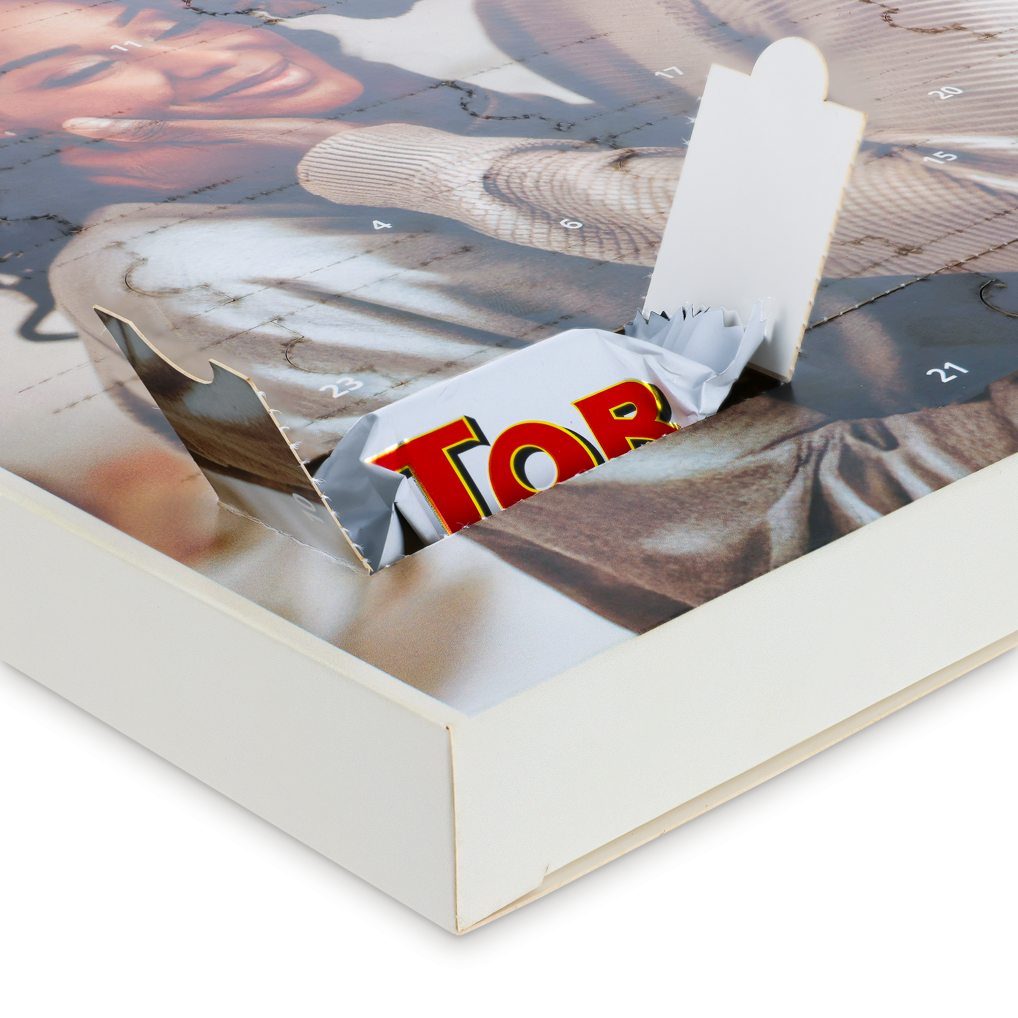 Personalised advent calendar with a printed photo of a smiling woman and a Toblerone chocolate visible in an open door. Count down to Christmas.