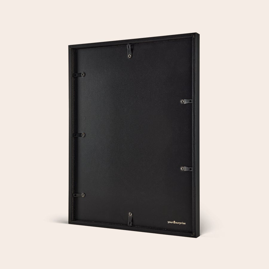 Personalised photo print with frame Personalized photo print with a black frame showing its back for wall hanging